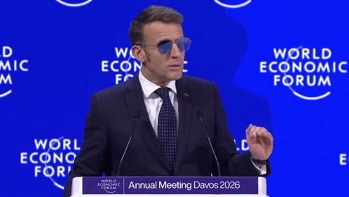 A Man Wearing Sunglasses Is Giving A Speech At The Annual Meeting Of The World Economic Forum GIF