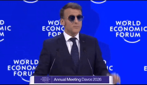 A Man Wearing Sunglasses Is Giving A Speech At The Annual Meeting Of The World Economic Forum GIF