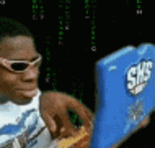 A Man Wearing Sunglasses Is Holding A Box Of Shredded Cheese GIF