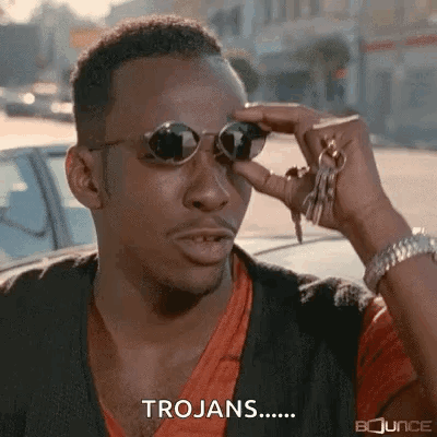 A Man Wearing Sunglasses Is Holding A Bunch Of Keys And Saying Trojans . GIF