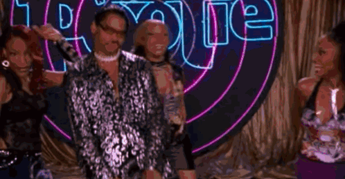 A Man Wearing Sunglasses Is Holding A Woman 'S Hand In A Close Up . GIF
