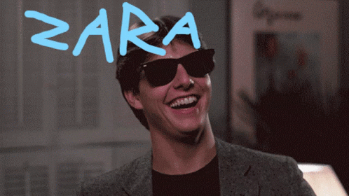 A Man Wearing Sunglasses Is Laughing With The Word Zara Written On His Forehead GIF