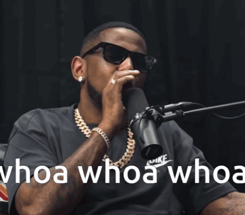 A Man Wearing Sunglasses Is Singing Into A Microphone With The Words Whoa Whoa Whoa GIF