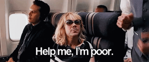 A Man Wearing Sunglasses Is Sitting On A Plane And Asking For Help . GIF