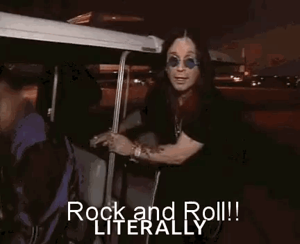 A Man Wearing Sunglasses Is Standing In A Golf Cart And Says `` Rock And Roll ! '' GIF