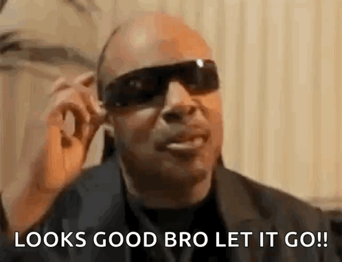 A Man Wearing Sunglasses Is Talking On A Cell Phone And Says `` Looks Good Bro Let It Go ! '' GIF