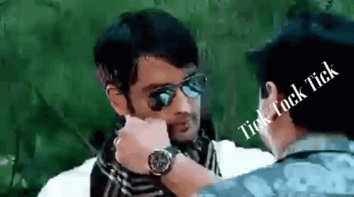 A Man Wearing Sunglasses Is Talking To Another Man With The Words Tick Tock Tick Above Him GIF