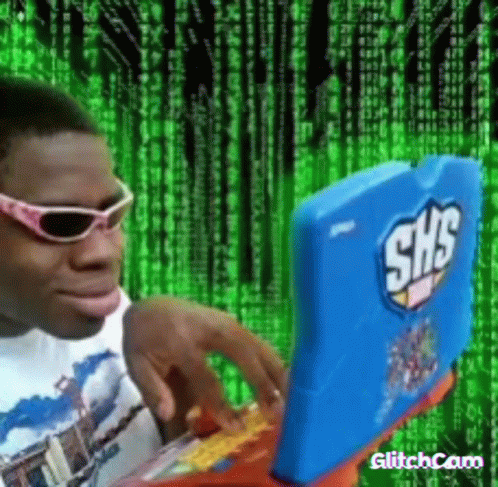 A Man Wearing Sunglasses Is Typing On A Laptop With The Word Shs On It GIF