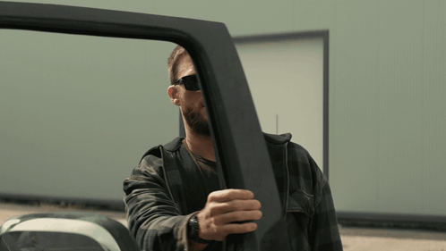 Man Wearing Sunglasses Opening Vehicle Door GIF