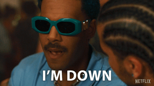 A Man Wearing Sunglasses Says I 'M Down Next To Another Man GIF