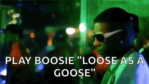 A Man Wearing Sunglasses Says Play Boosie " Loose As A Goose " In Front Of A Crowd GIF