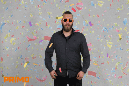 A Man Wearing Sunglasses Stands In Front Of Confetti And The Words It 'S Party Time GIF