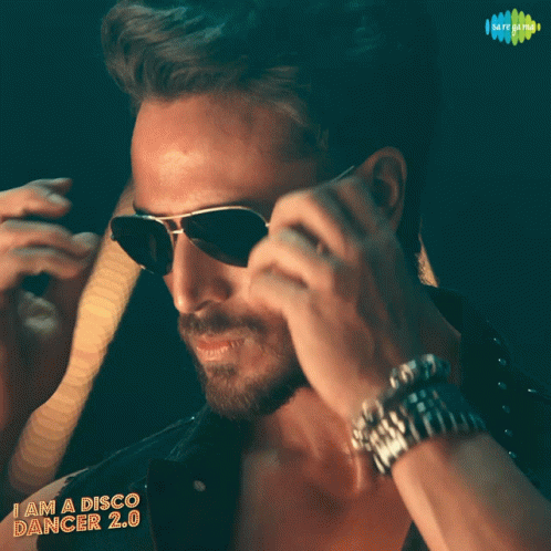 A Man Wearing Sunglasses With The Words I Am A Disco Dancer 2.0 GIF
