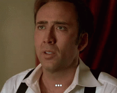 A Man Wearing Suspenders And A White Shirt Is Making A Funny Face . GIF
