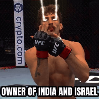 A Man Wearing Ufc Gloves Stands In Front Of A Crypto.com Banner GIF