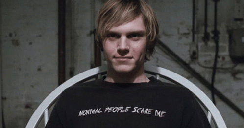 A Man Wears A Black Shirt That Says Normal People Scare Me GIF