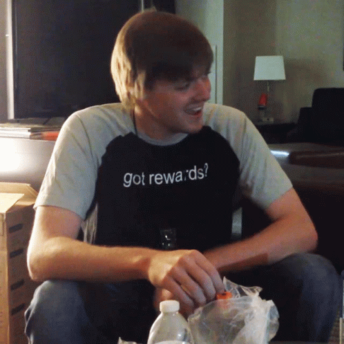 A Man Wears A Shirt That Says Got Rewards GIF
