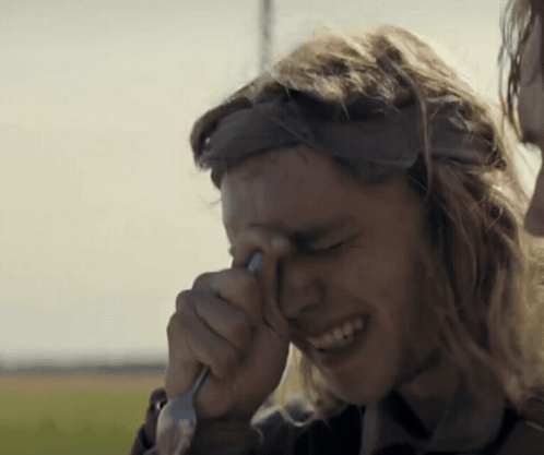 A Man Wipes His Eyes With A Fork GIF