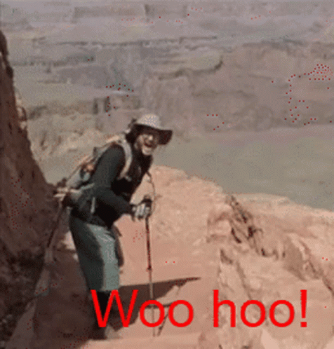 A Man With A Backpack And Hiking Poles Is Standing On A Rocky Cliff With The Words Woo Hoo Written In Red GIF