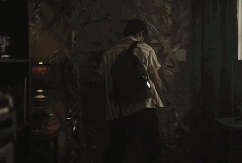 A Man With A Backpack Stands In A Dark Room With The Words If You 'Re Having Trouble With The Door Below Him GIF