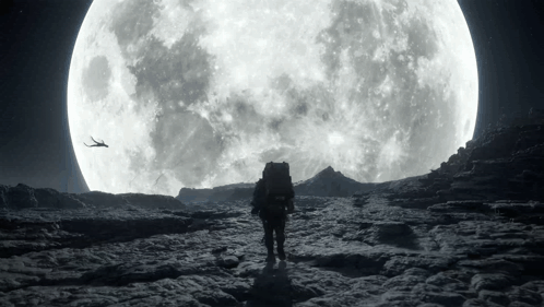 A Man With A Backpack Walking In Front Of A Large Full Moon GIF