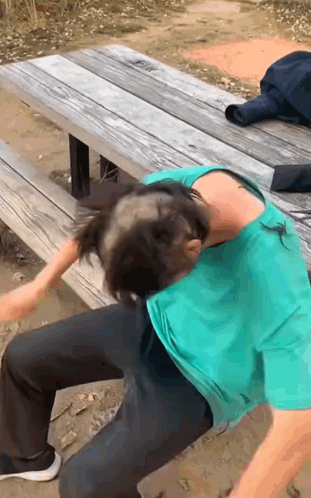 A Man With A Bald Head Is Sitting On A Bench GIF
