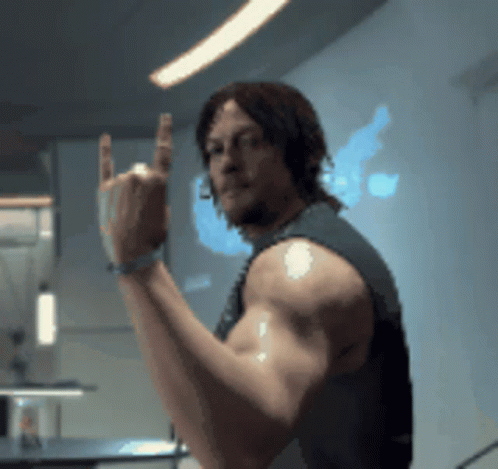 A Man With A Bandage On His Arm Is Giving A Middle Finger GIF