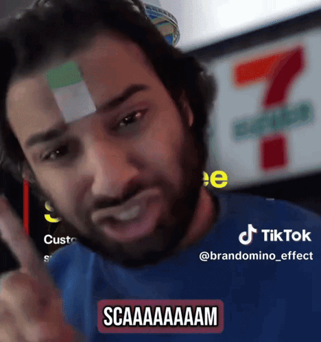 A Man With A Bandage On His Forehead Has A Tiktok Sticker On His Shirt GIF