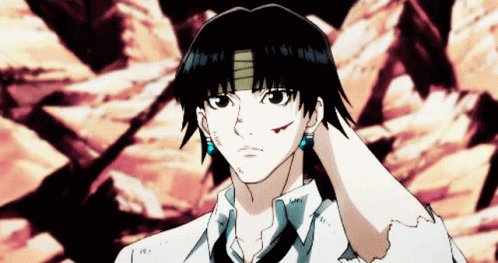 A Man With A Bandage On His Forehead Is Wearing Earrings GIF