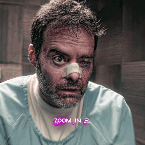 A Man With A Bandage On His Nose Has Zoom In 2 Written On The Bottom GIF