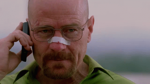 A Man With A Bandage On His Nose Talking On A Cell Phone GIF