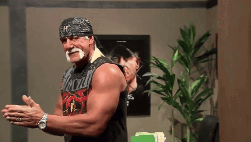 A Man With A Bandana On His Head And A Shirt That Says Hogan On It GIF