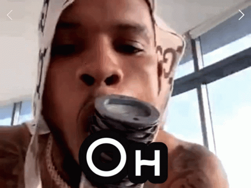 A Man With A Bandana On His Head Is Holding A Can In His Mouth With The Word Oh Above It GIF