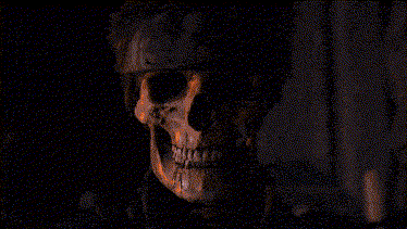 A Man With A Bandana On His Head Is Looking At The Camera In A Pixelated Image . GIF