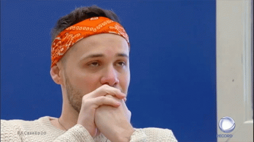 A Man With A Bandana On His Head Is On A Record Show GIF