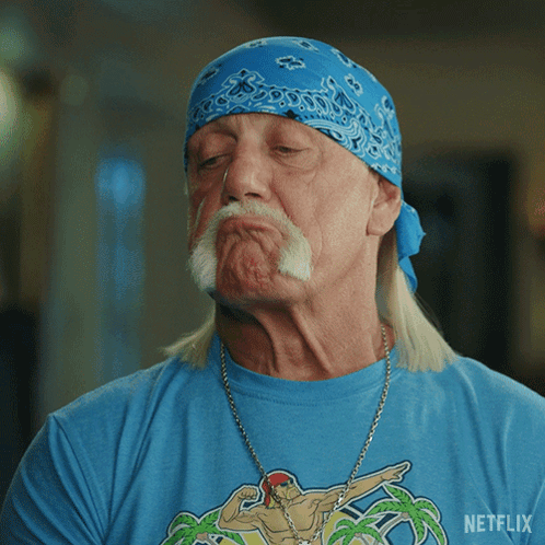 A Man With A Bandana On His Head Is Wearing A Netflix T-Shirt GIF