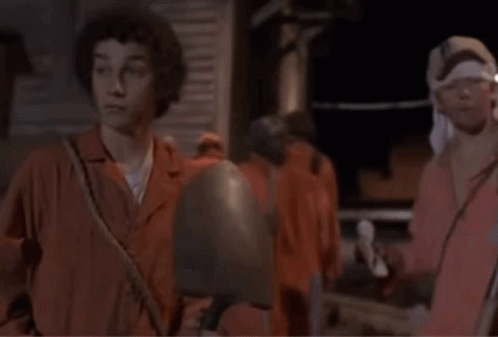 A Man With A Bandana On His Head Talks To Another Man With The Words Smaller Shovel Written Below Them GIF