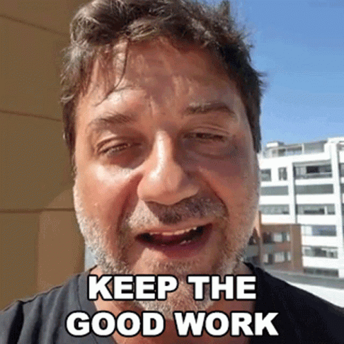 A Man With A Beard And A Black Eye Is Making A Funny Face And Saying `` Keep The Good Work '' . GIF