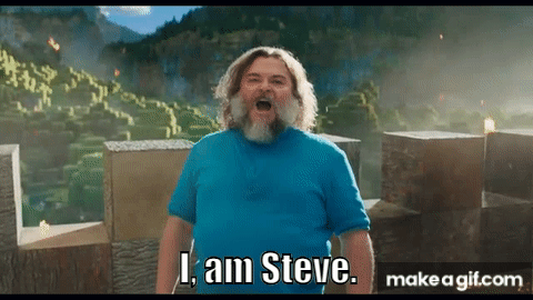 A Man With A Beard And A Blue Shirt Is Standing In Front Of A Mountain And Saying I Am Steve . GIF