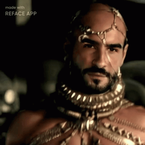 A Man With A Beard And A Crown On His Head Is Being Made With Reface App GIF