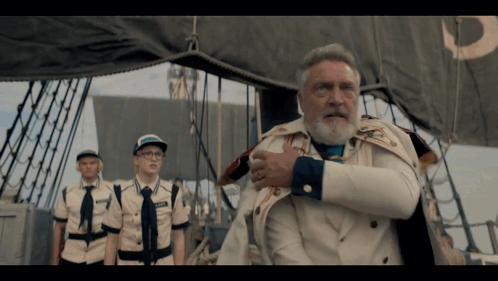 A Man With A Beard And A Name Tag That Says " Captain " On It GIF