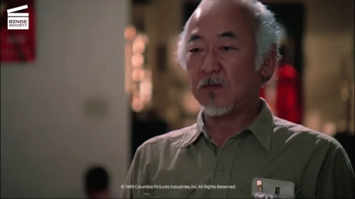 A Man With A Beard And A Name Tag That Says Columbia Pictures Industries Inc. All Rights Reserved GIF