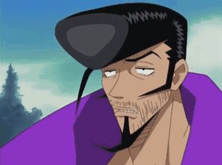 A Man With A Beard And A Purple Shirt Has A Black Hat On GIF
