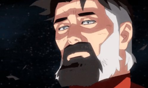 a man with a beard and a red shirt looks up into the sky