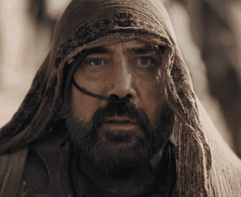 A Man With A Beard And A Scarf Around His Head Has A Hose Coming Out Of His Nose GIF