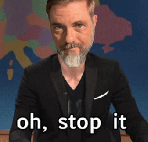 A Man With A Beard And A Suit Says Oh Stop It GIF