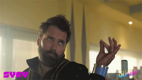 A Man With A Beard And A Syfy Logo On The Bottom Right GIF