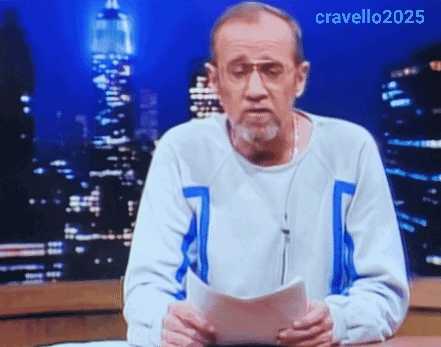 A Man With A Beard And Glasses Is Holding A Piece Of Paper In Front Of A City Skyline .. GIF