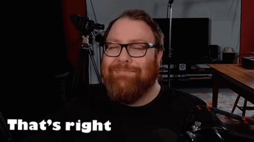 A Man With A Beard And Glasses Is Smiling And Saying That 'S Right GIF