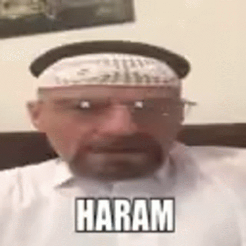 A Man With A Beard And Glasses Is Wearing A Hat And A Bandana And Says Haram . GIF